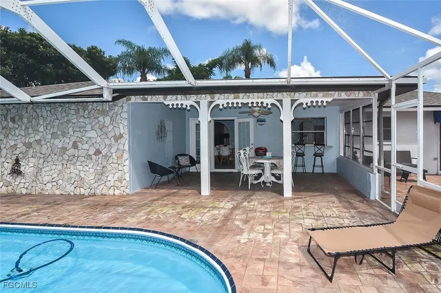 a view of a chairs and table in the patio