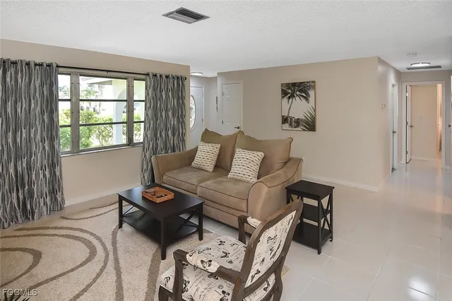 a living room with furniture and rug