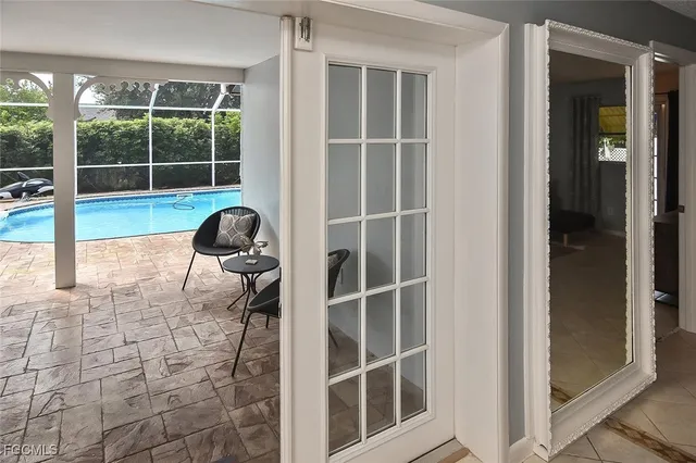 a view of a house with backyard and sitting area