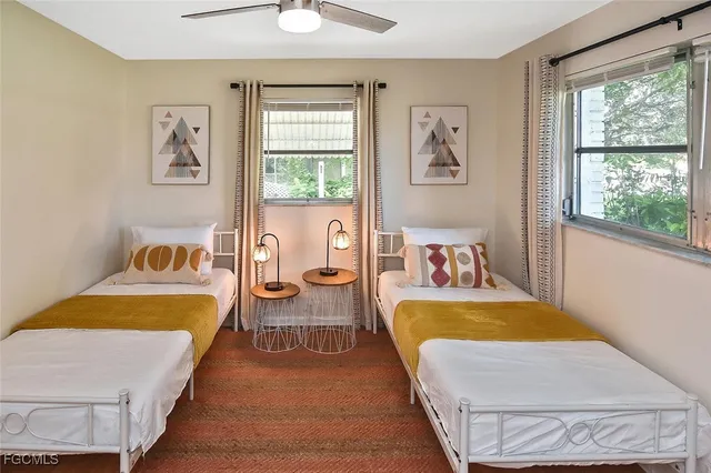 an empty room with wooden floor cabinet and closet