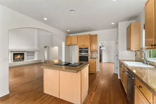 a view of a livingroom with a ceiling fan and window