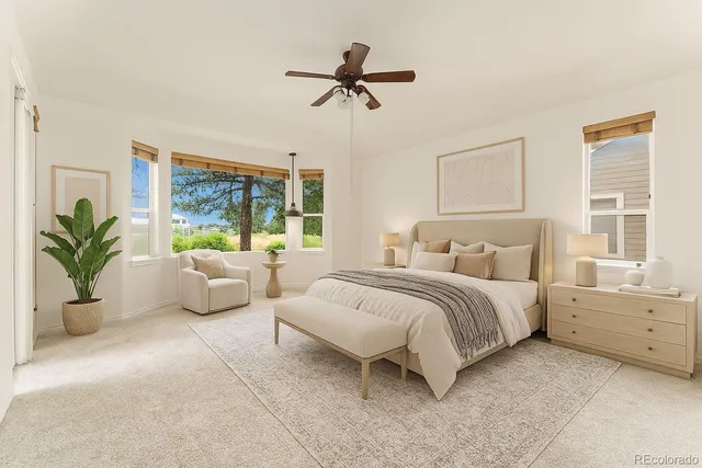 a large white bathroom with a large tub and shower