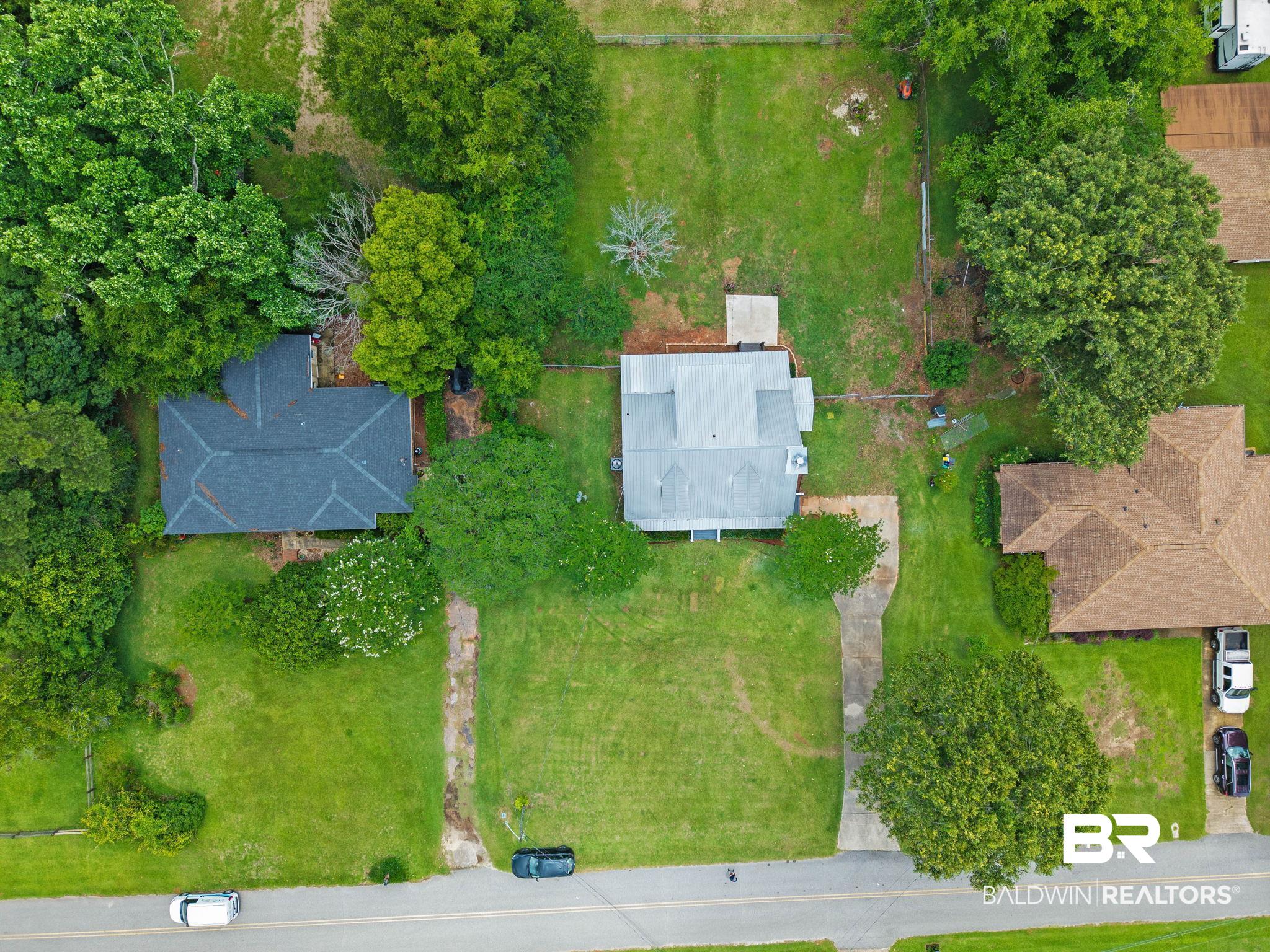 22810 High Ridge Road Fairhope, AL 36532 - Photo 78 of 78 Expansive property featuring a central residence, mature trees, green lawn space, and paved driveway access