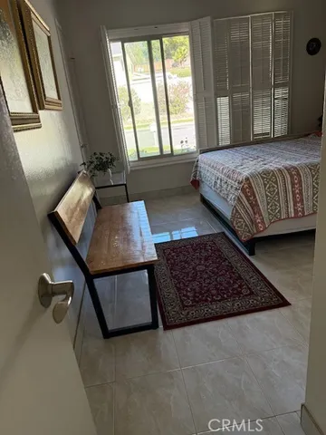 a living room with a couch and large window