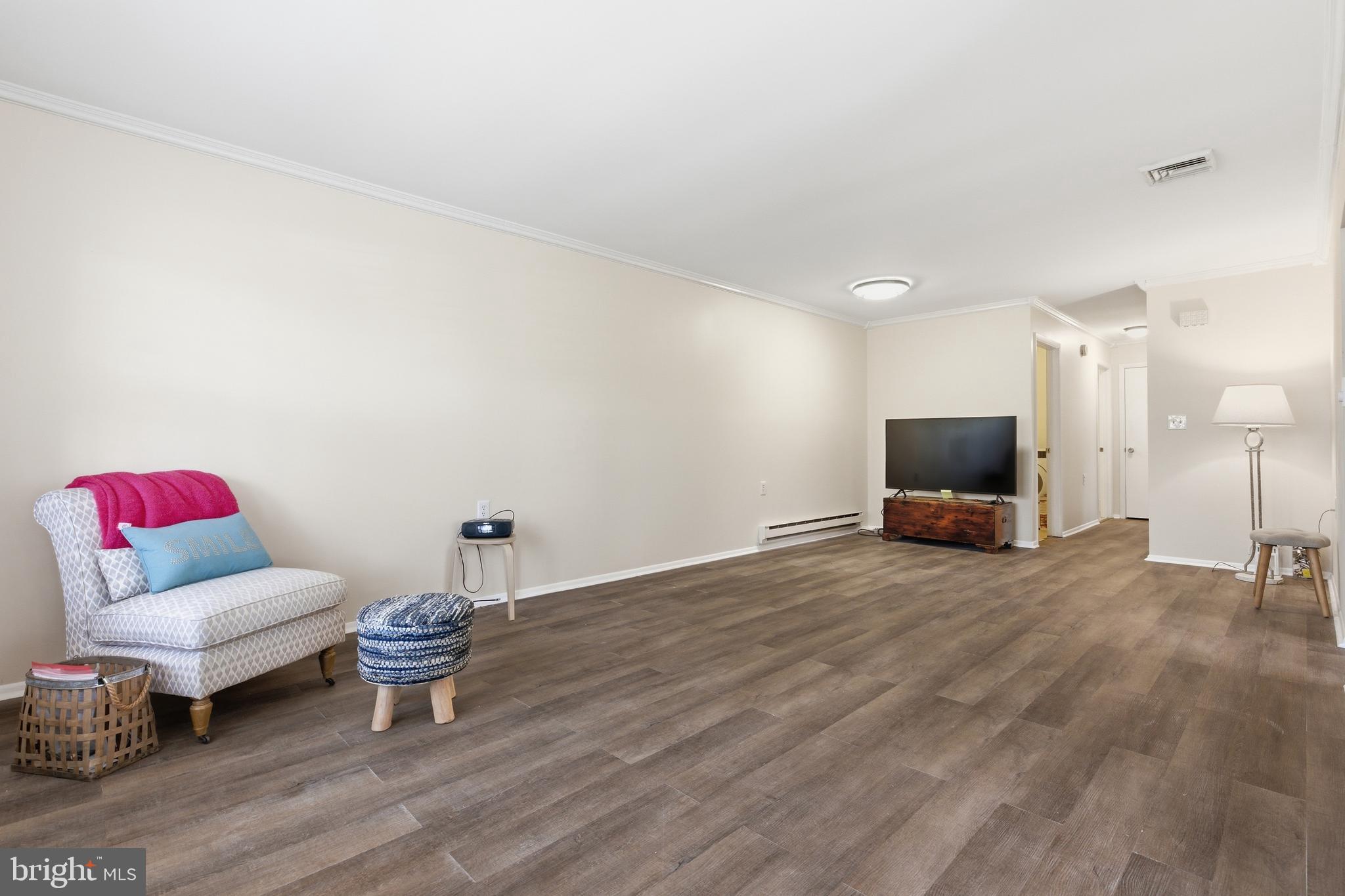 43B Magnolia Road Manahawkin, NJ 08050 - Photo 12 of 26 a living room with furniture and a flat screen tv