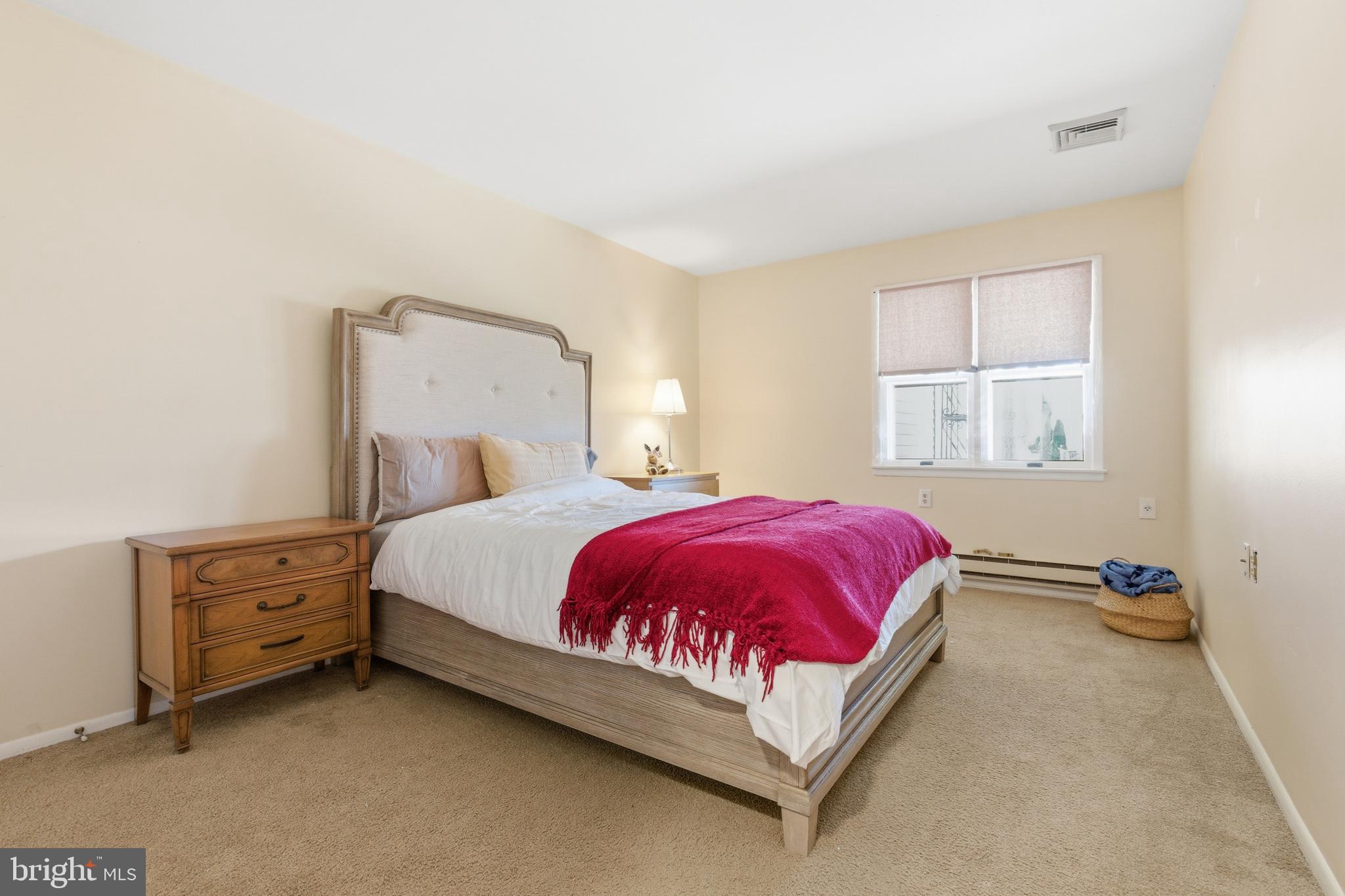 43B Magnolia Road Manahawkin, NJ 08050 - Photo 17 of 26 a bed sitting in a bedroom next to a window