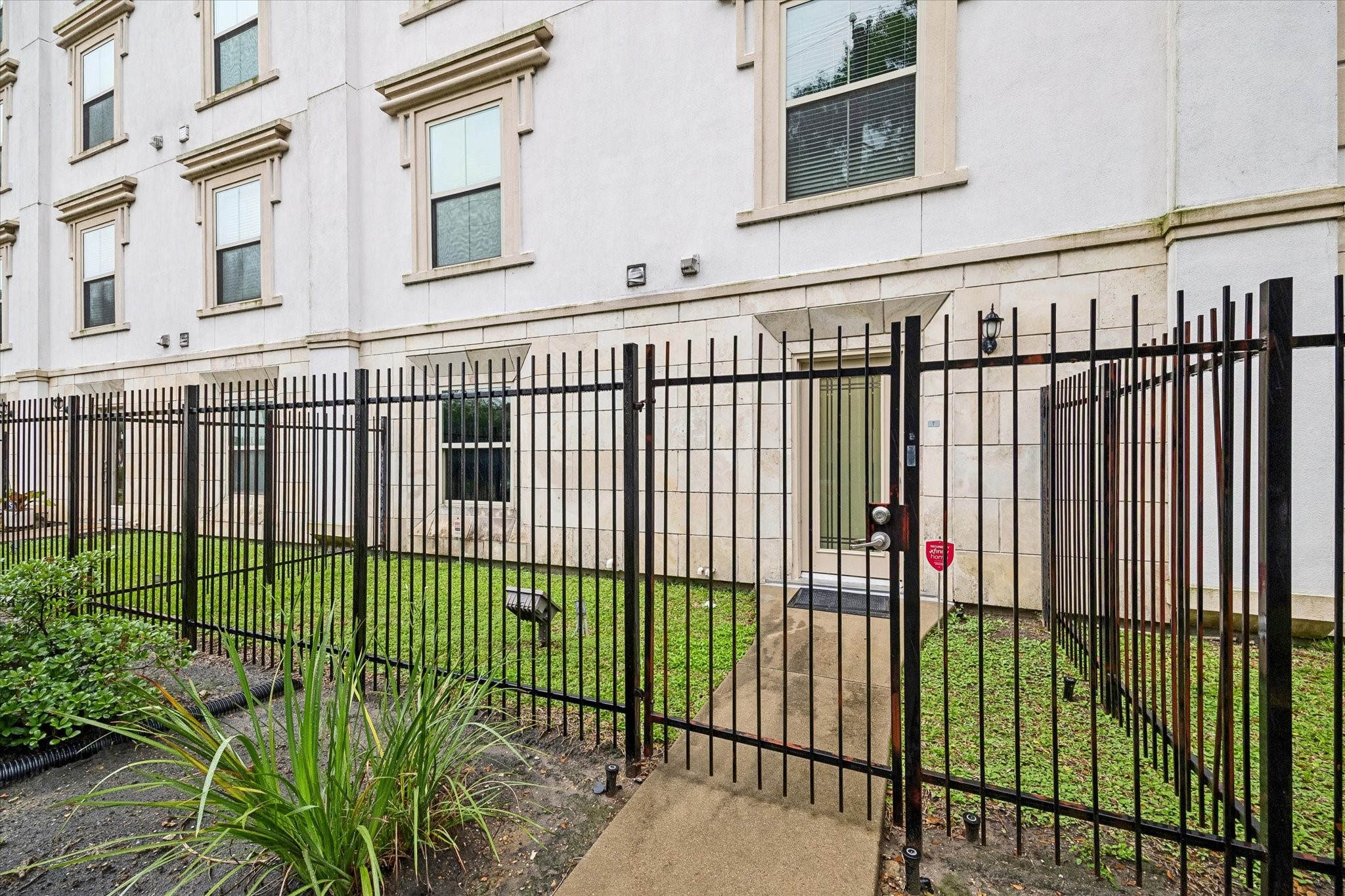 3501 Chenevert Street, Unit 7 Houston, TX 77004 - Photo 3 of 21 Closer view of the private gated entry and exclusive yard space. One of the few in the community, along with abundant street parking just outside for added convenience.