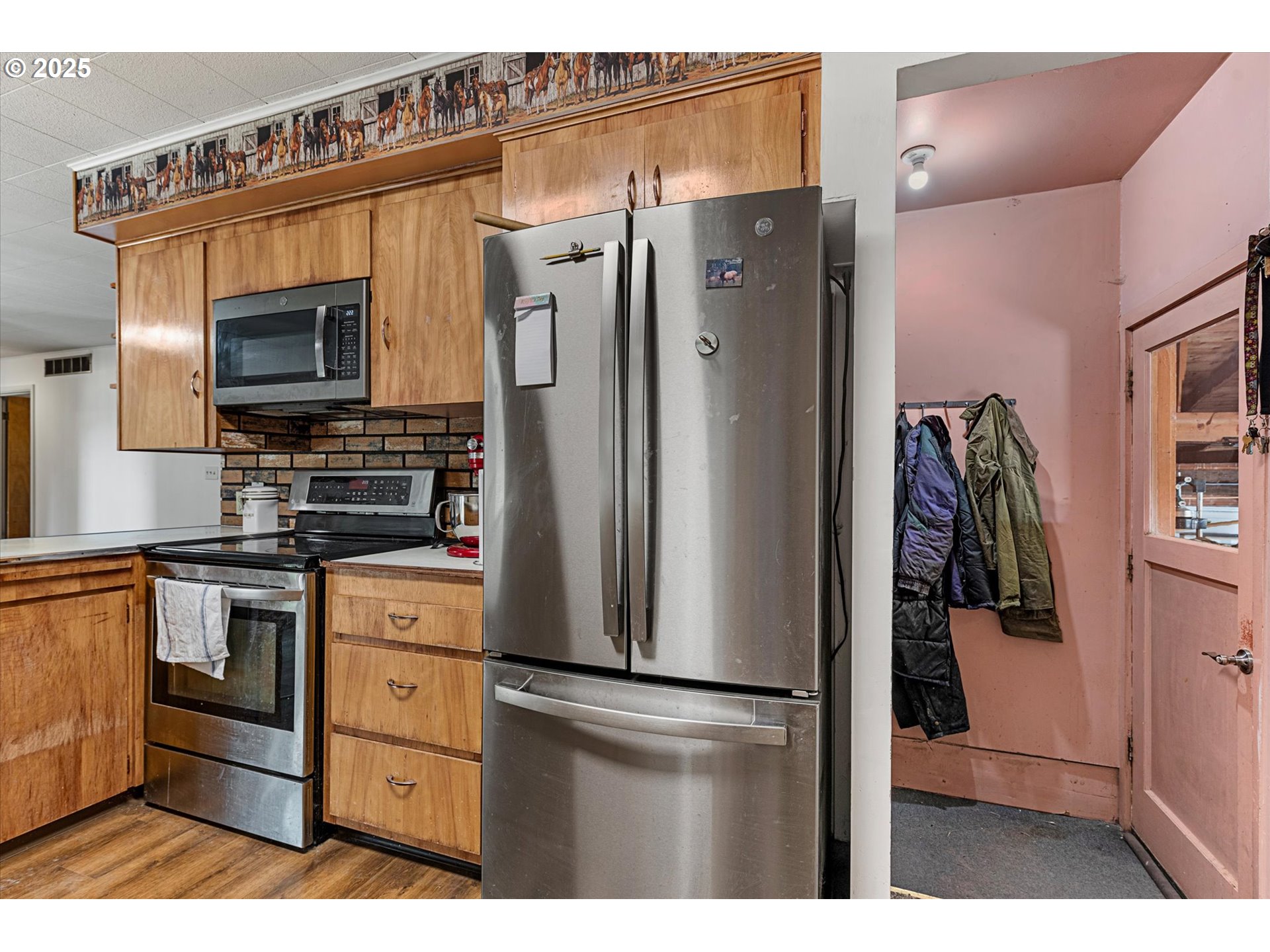 37799 Alder Creek Road Baker City, OR 97814 - Photo 12 of 41 a kitchen with stainless steel appliances a refrigerator and a stove top oven