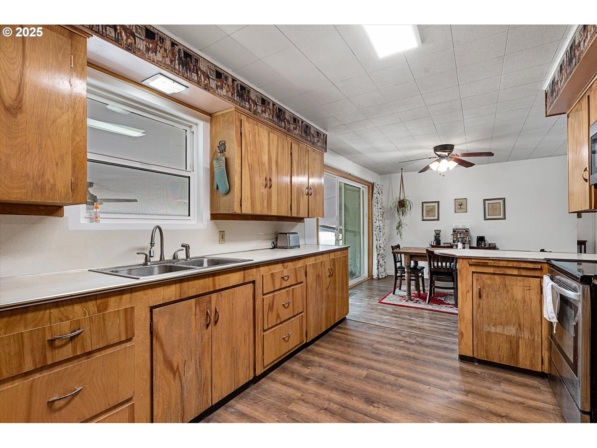 37799 Alder Creek Road Baker City, OR 97814 - Photo 14 of 41 a kitchen with granite countertop a sink cabinets and stainless steel appliances