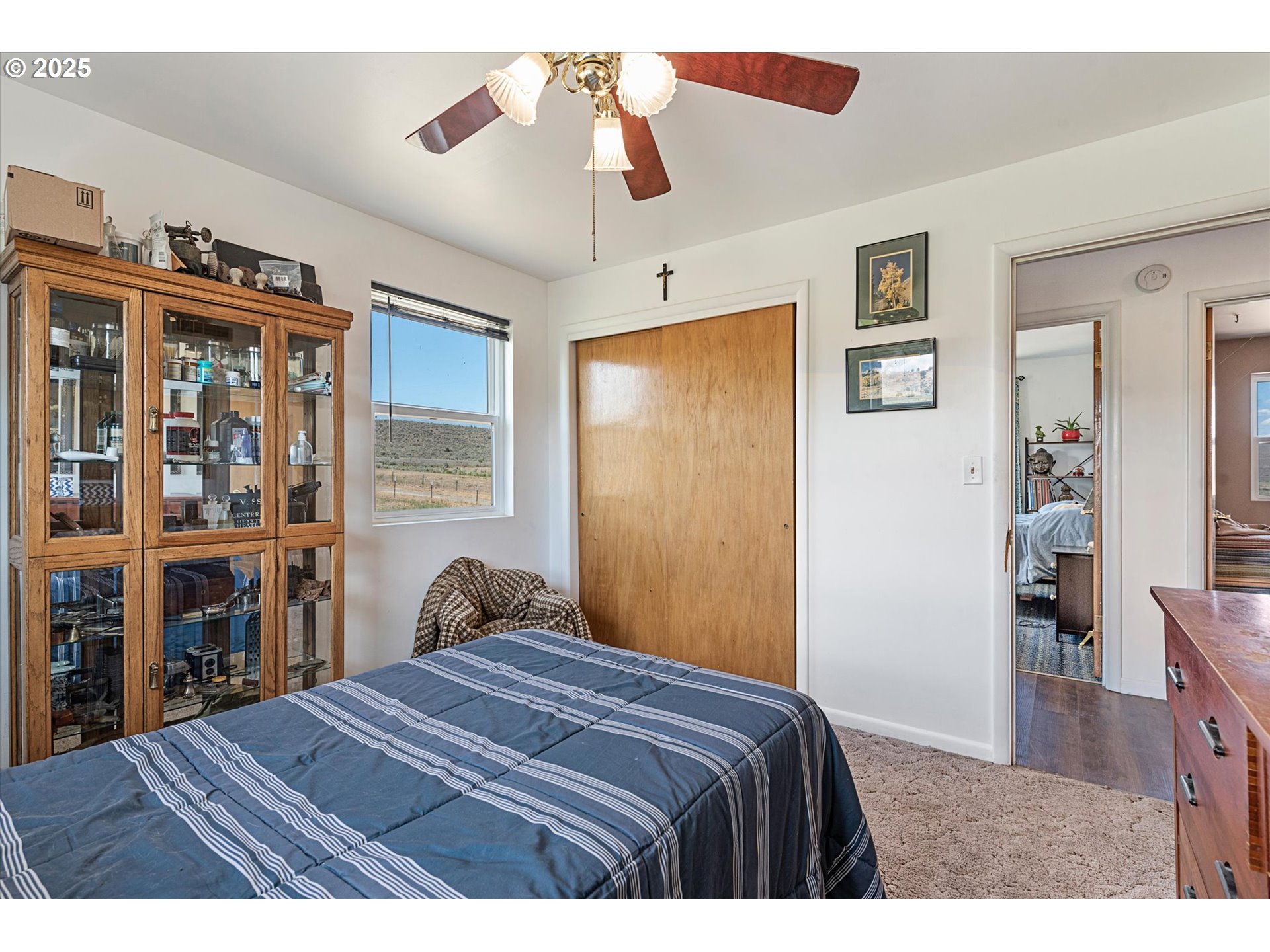 37799 Alder Creek Road Baker City, OR 97814 - Photo 15 of 41 a bedroom with a bed and a book shelf