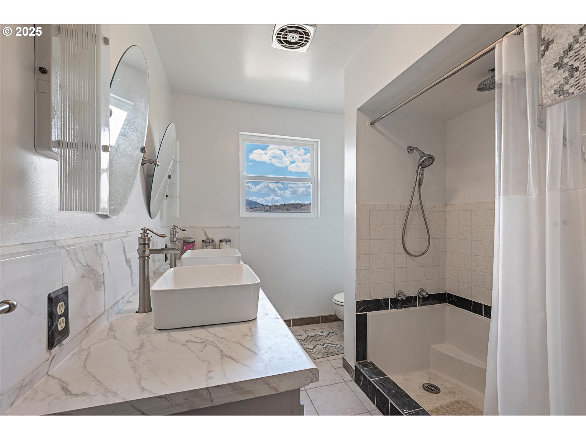 37799 Alder Creek Road Baker City, OR 97814 - Photo 24 of 41 a bathroom with a sink mirror and a bath tub