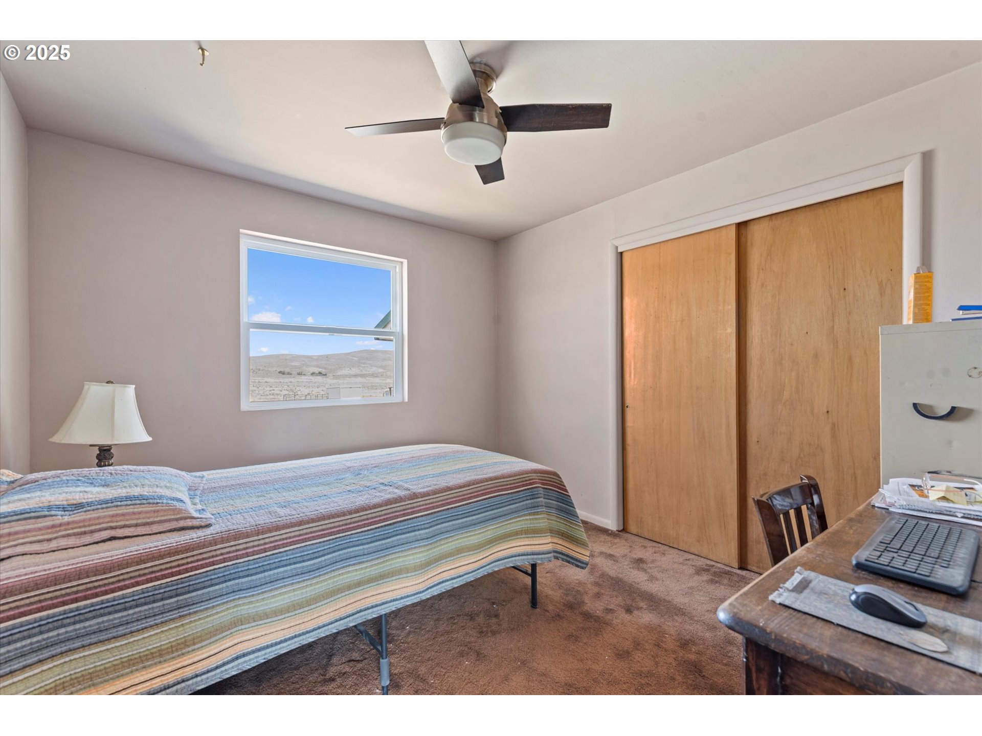 37799 Alder Creek Road Baker City, OR 97814 - Photo 29 of 41 a bedroom with a bed and a window