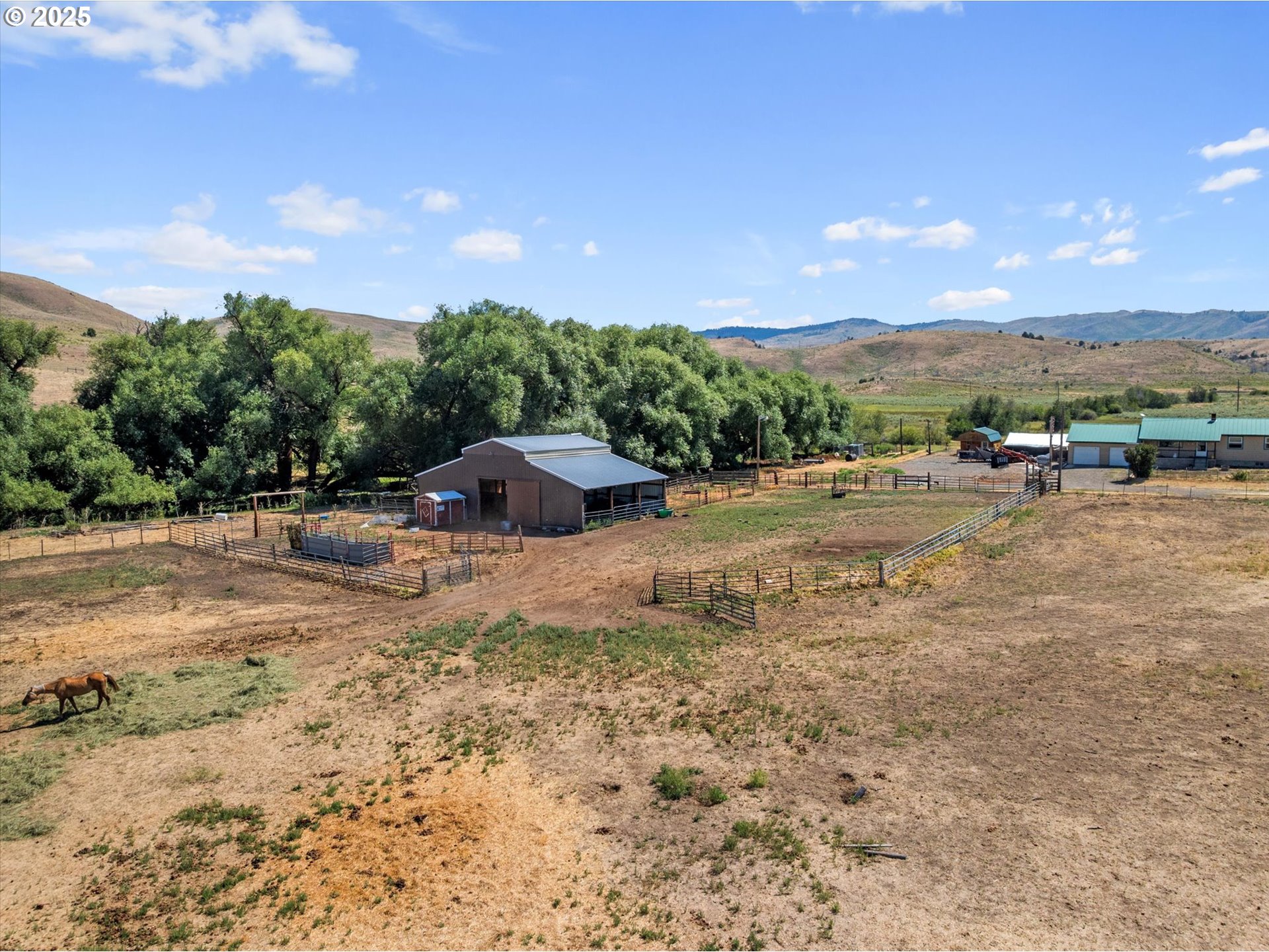 37799 Alder Creek Road Baker City, OR 97814 - Photo 38 of 41 a view of a dirt road with a building in the background