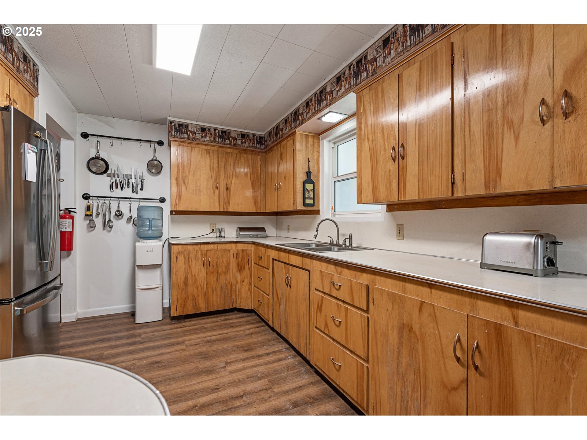 37799 Alder Creek Road Baker City, OR 97814 - Photo 10 of 41 a kitchen with granite countertop stainless steel appliances a refrigerator sink and cabinets