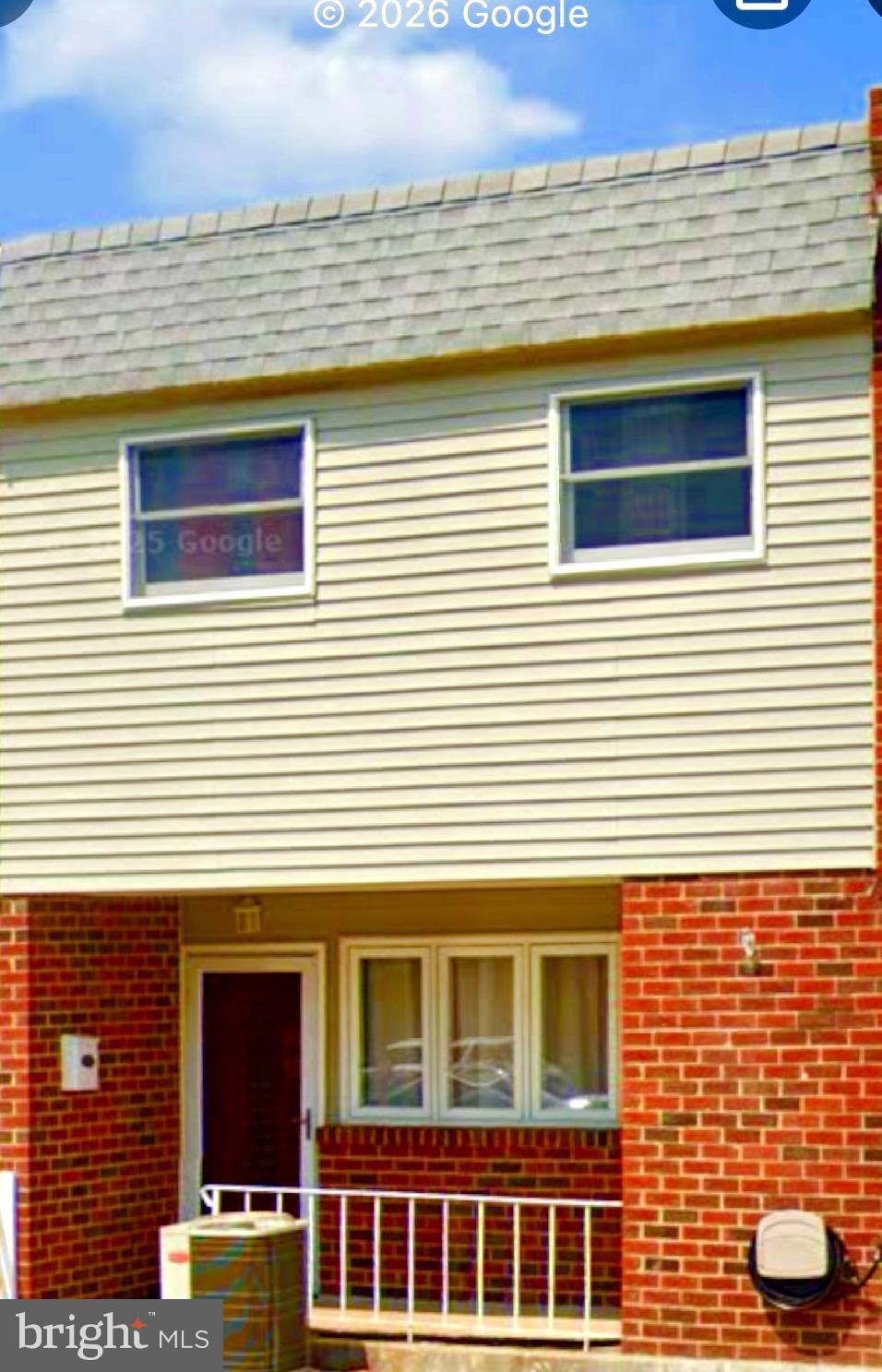a view of a house with a door and a window