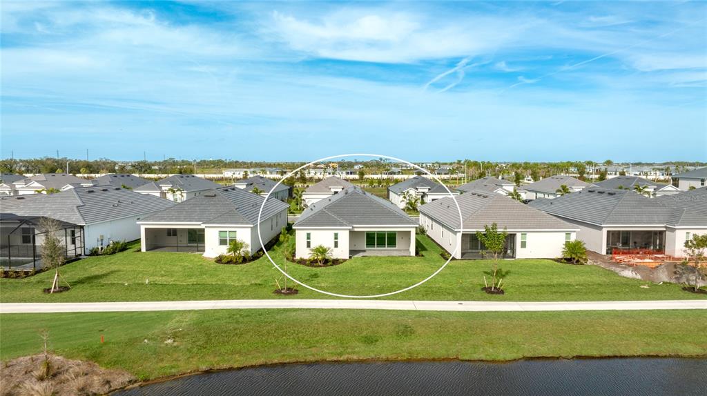 19156 Cherrystone Way Lakewood Ranch, FL 34211 - Photo 37 of 49 an aerial view of residential houses with outdoor space and swimming pool