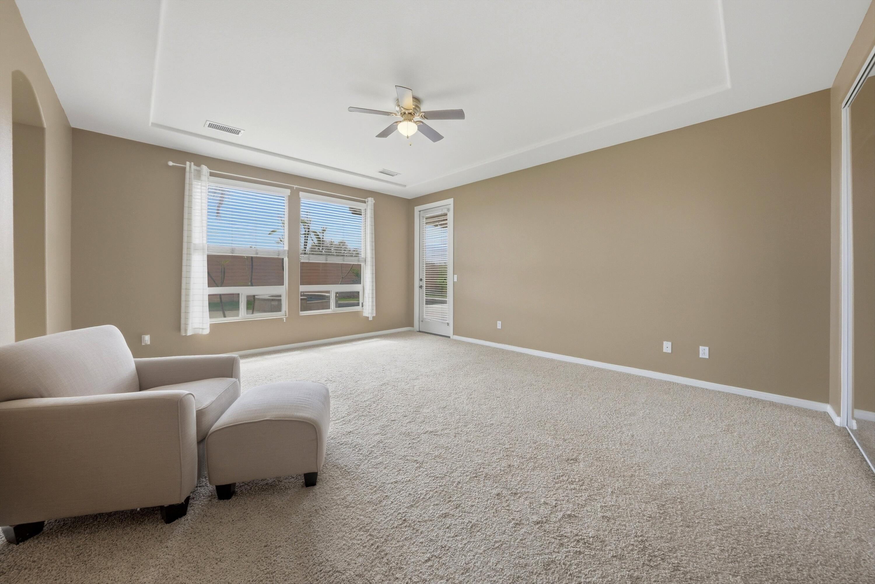 232 Via Firenza Rancho Mirage, CA 92270 - Photo 22 of 43 a living room with furniture and a large window