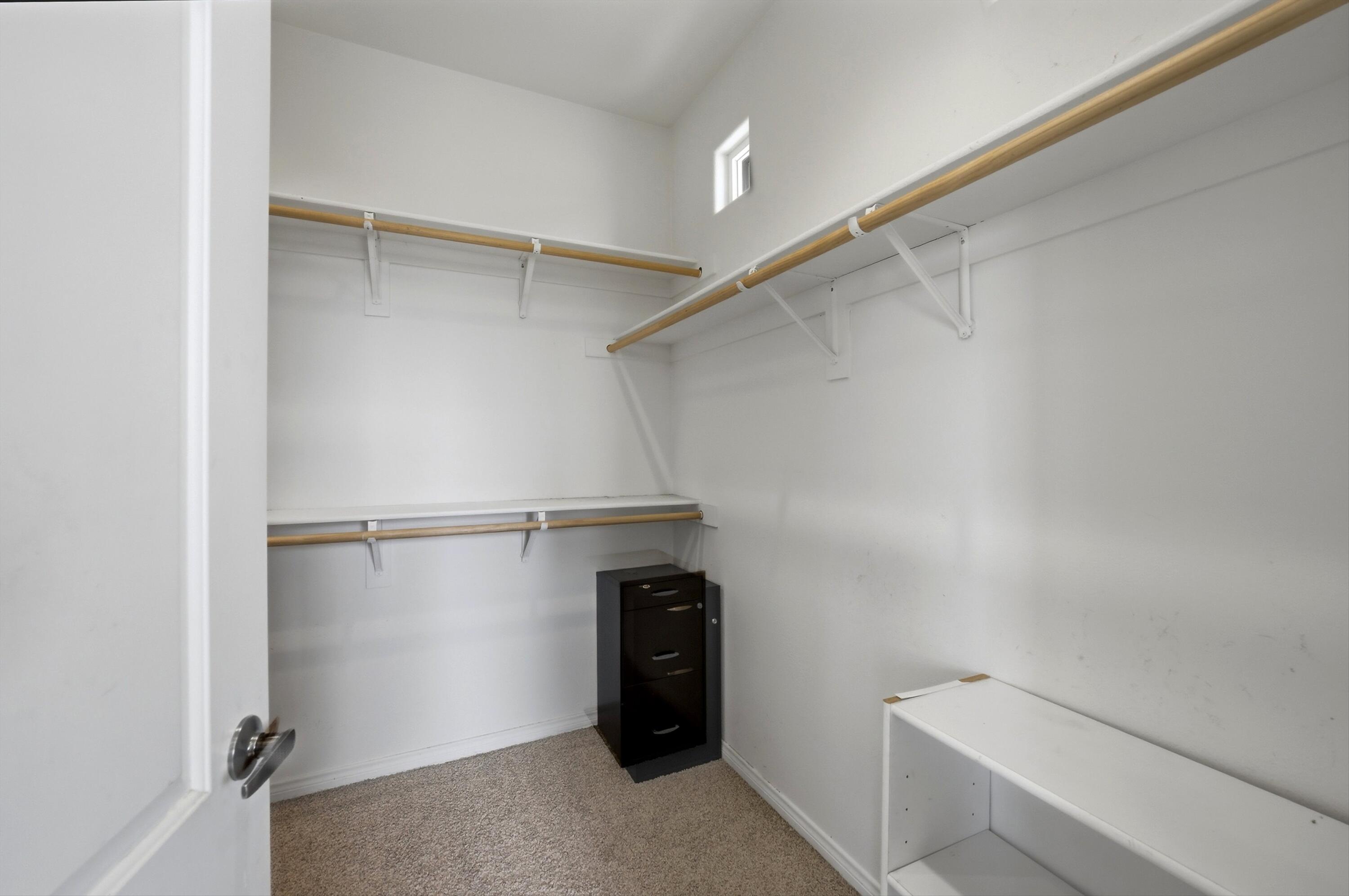 232 Via Firenza Rancho Mirage, CA 92270 - Photo 27 of 43 a view of walk in closet with empty racks