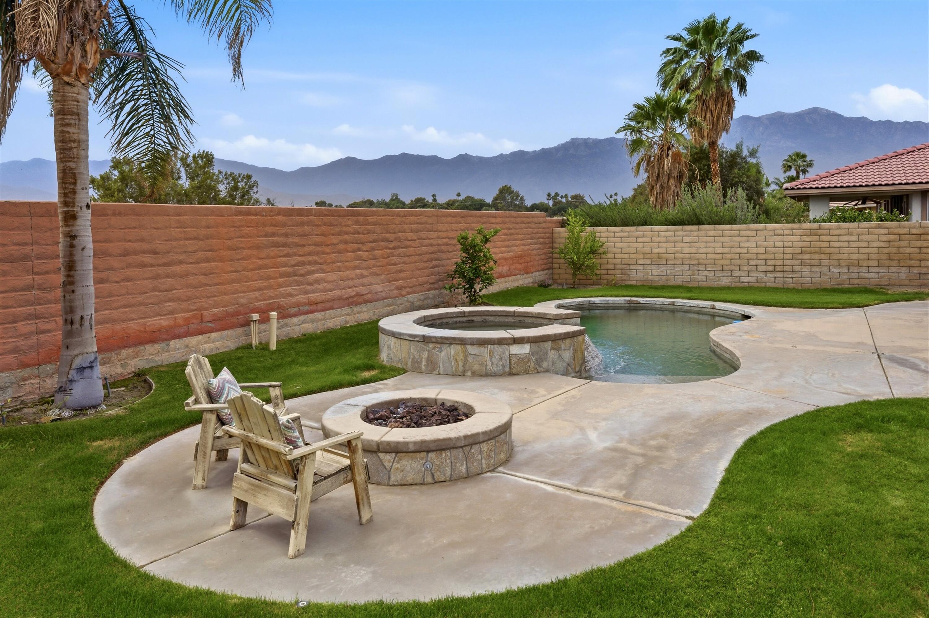 232 Via Firenza Rancho Mirage, CA 92270 - Photo 32 of 43 a view of a swimming pool with lounge chair