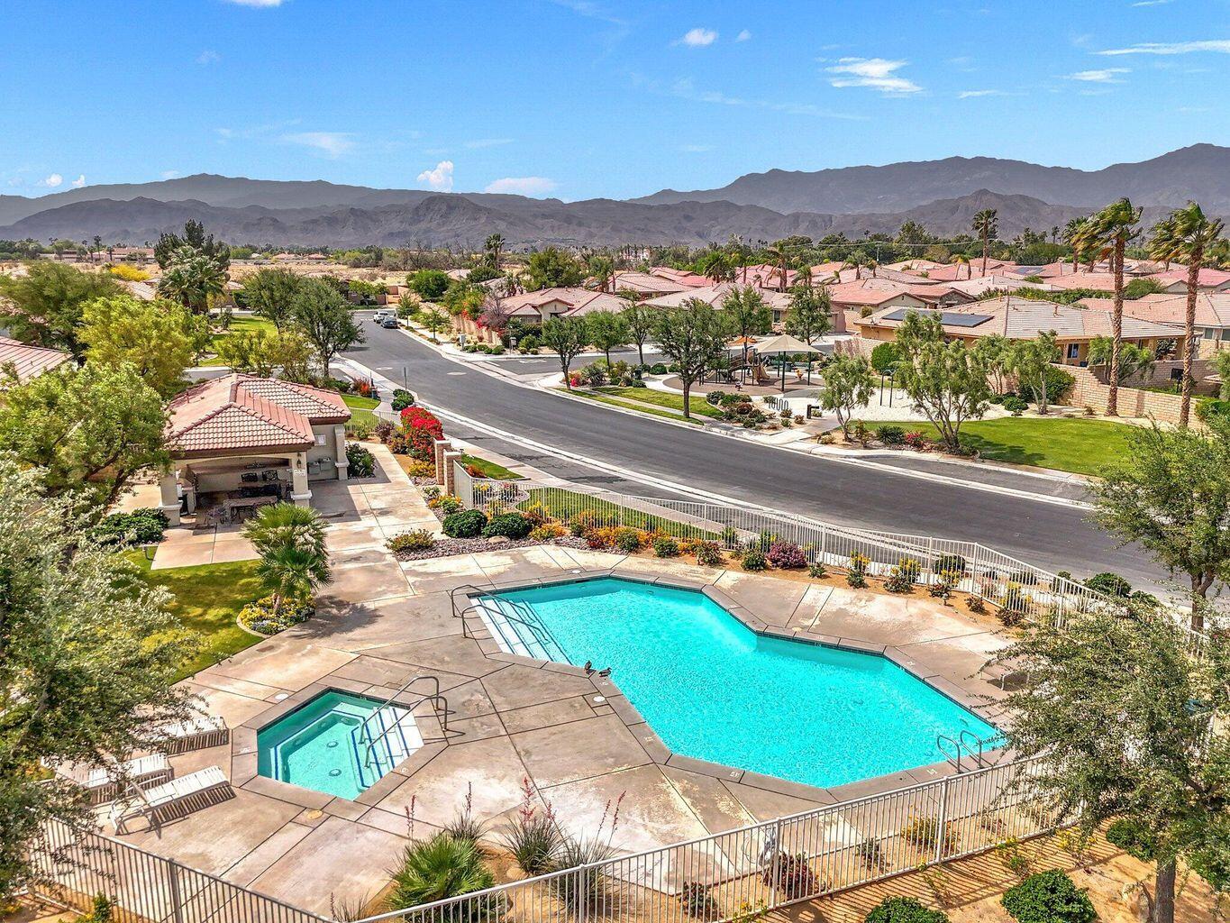 232 Via Firenza Rancho Mirage, CA 92270 - Photo 41 of 43 a view of a swimming pool with a lake and mountain view