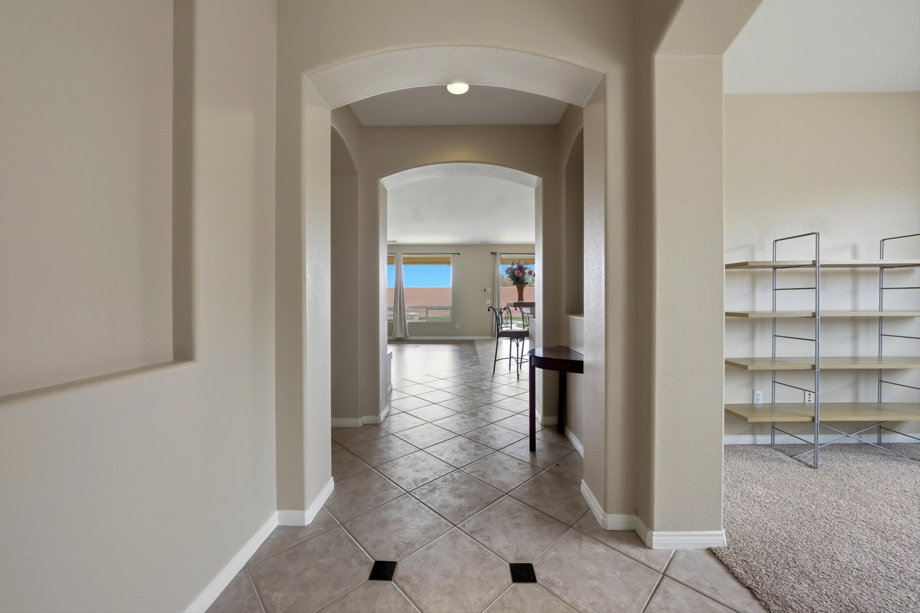 232 Via Firenza Rancho Mirage, CA 92270 - Photo 5 of 43 a view of a hallway with wooden shelves