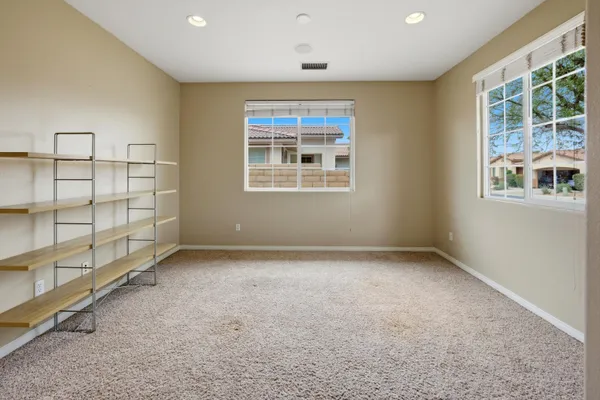 an empty room with windows