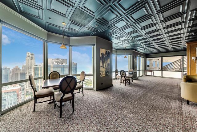 a view of a chairs and table in a room