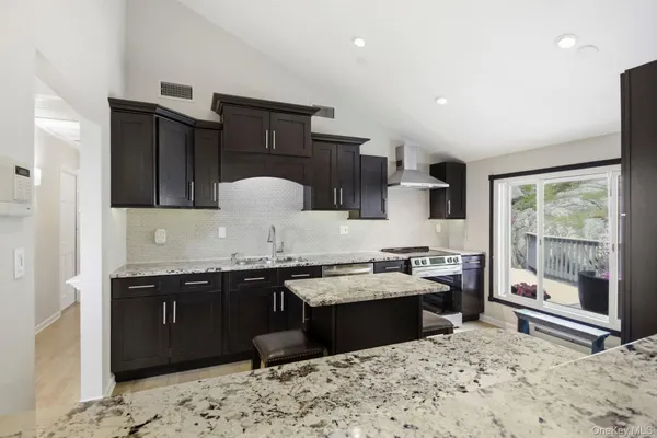 a kitchen with a sink and wooden cabinets