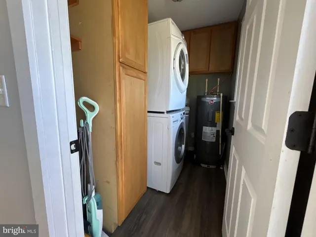a view of closet with wooden floor