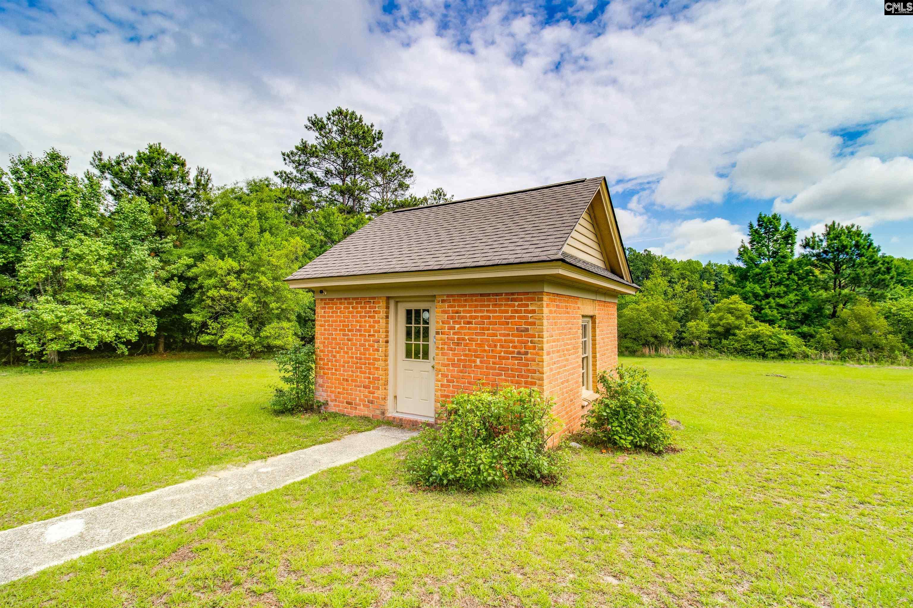 701 Longtown Road Columbia, SC 29229 - Photo 26 of 26 a yellow house with a yard in front of it