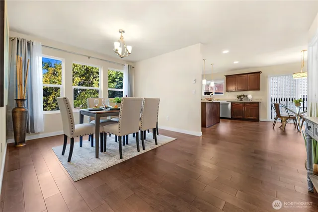 a view of a dining room with furniture window and wooden floor
