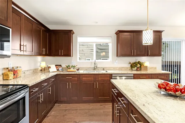 a kitchen with a sink and cabinets