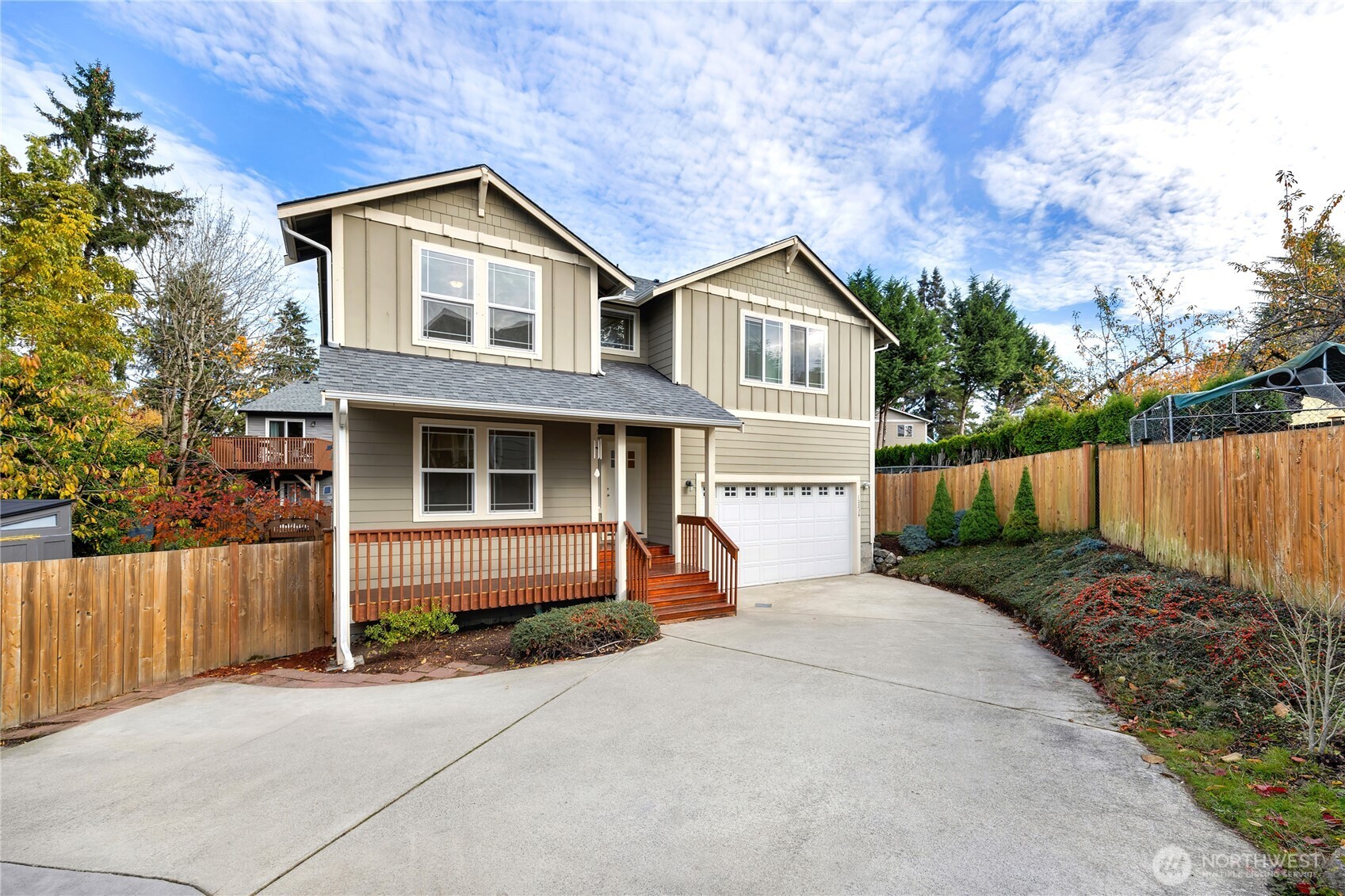 10034 59th Avenue South Seattle, WA 98178 - Photo 2 of 39 a front view of a house with a yard and garage