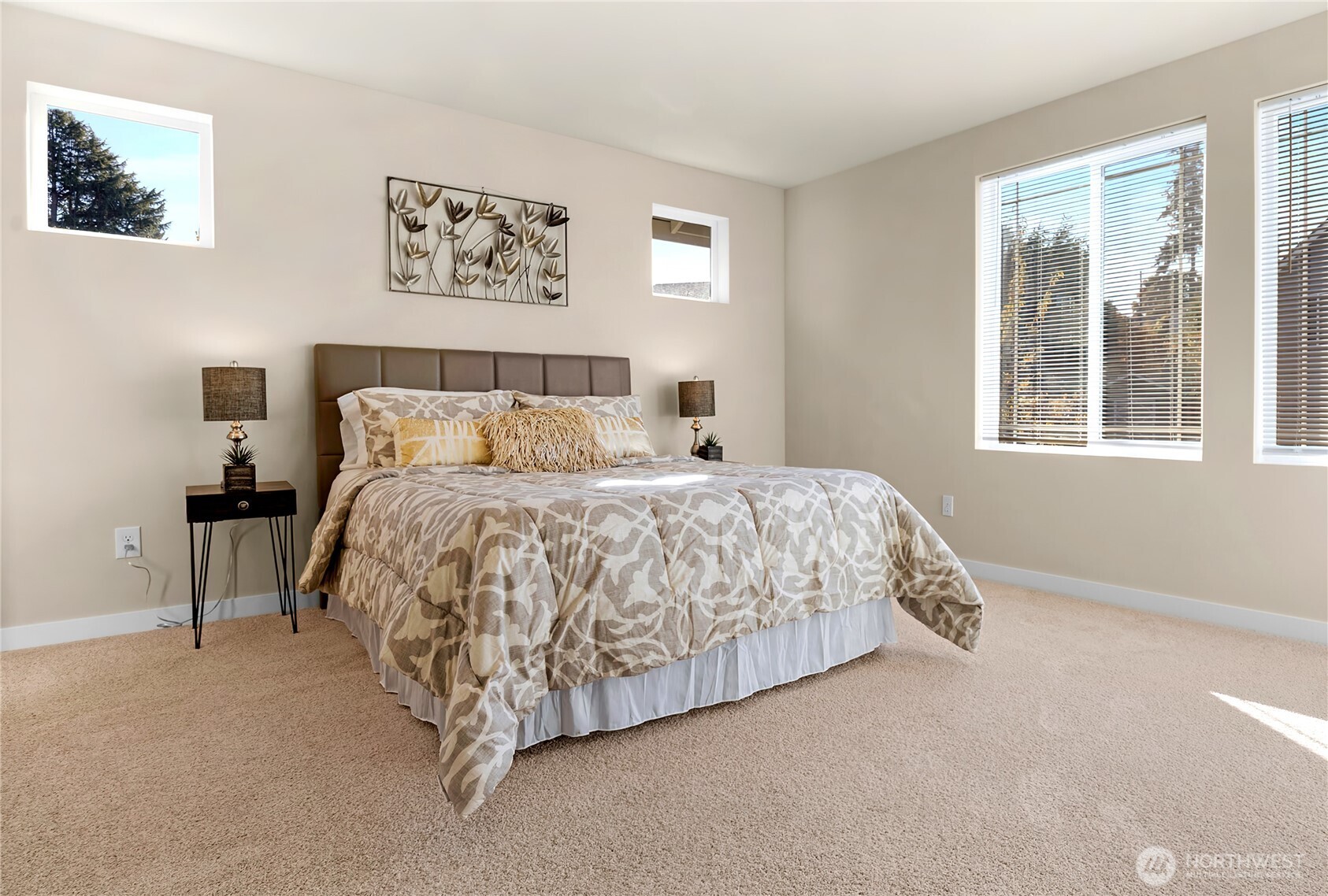 10034 59th Avenue South Seattle, WA 98178 - Photo 29 of 39 a large bed sitting in a bedroom next to a window