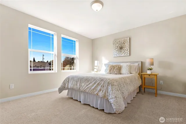 a bedroom with a bed and window