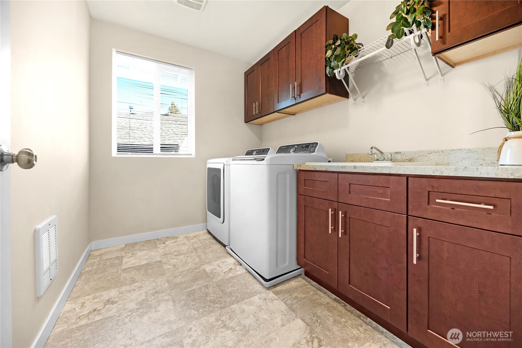 10034 59th Avenue South Seattle, WA 98178 - Photo 33 of 39 a kitchen with a sink cabinets and window
