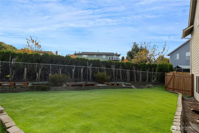 a backyard with table and chairs