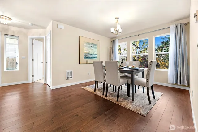 a view of a dining room with furniture window and wooden floor