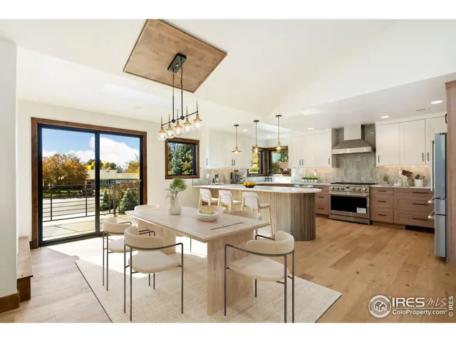 a kitchen with kitchen island a stove a sink and a counter top space