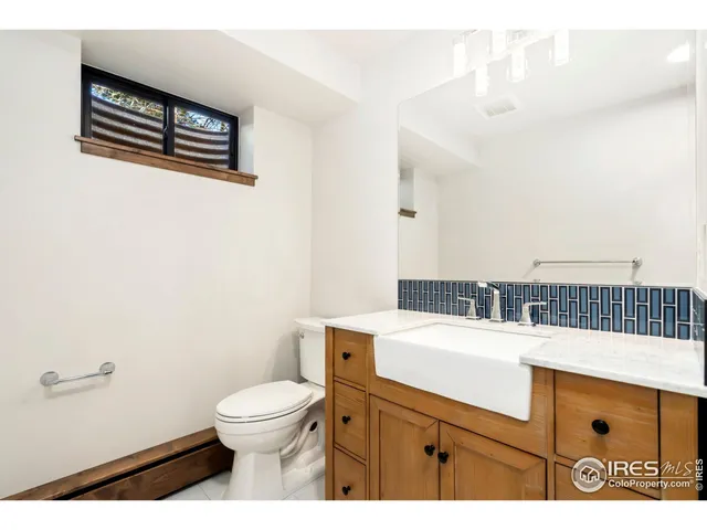 a view of a house with a yard and a garden