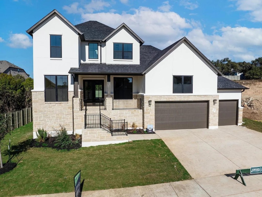 a front view of a house with a yard