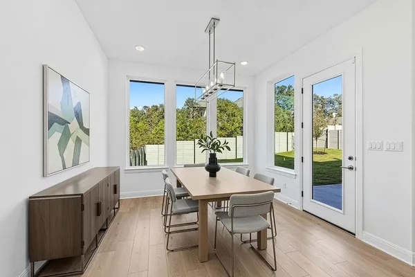 a dining room with furniture window wooden floor