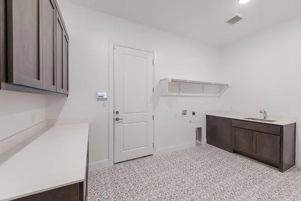 a view of a storage and utility room with closet