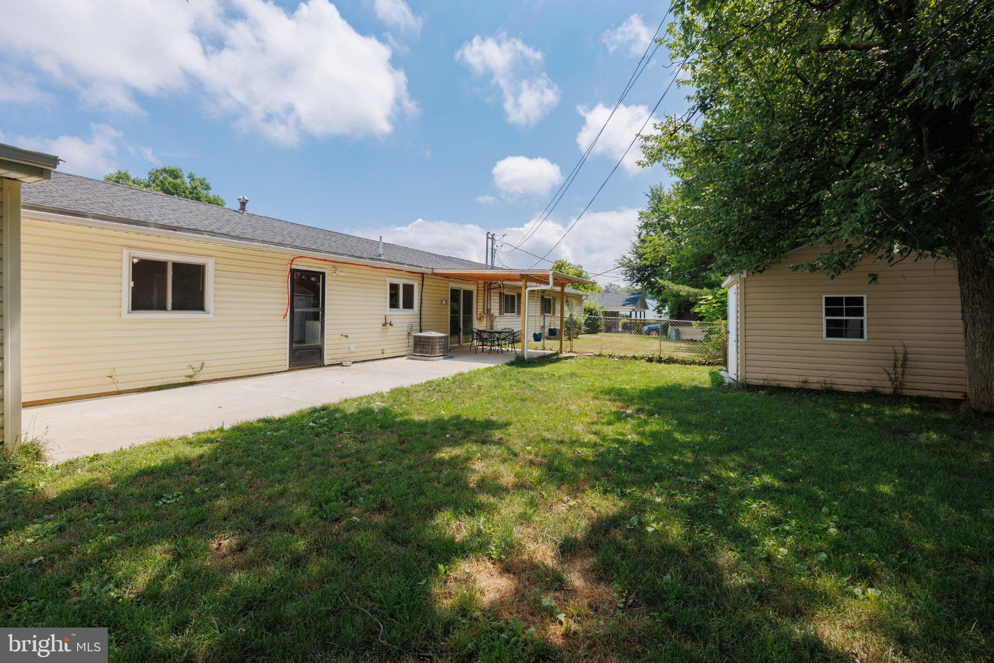 2106 North Rolling Road Windsor Mill, MD 21244 - Photo 24 of 24 Spacious backyard with sunny skies.