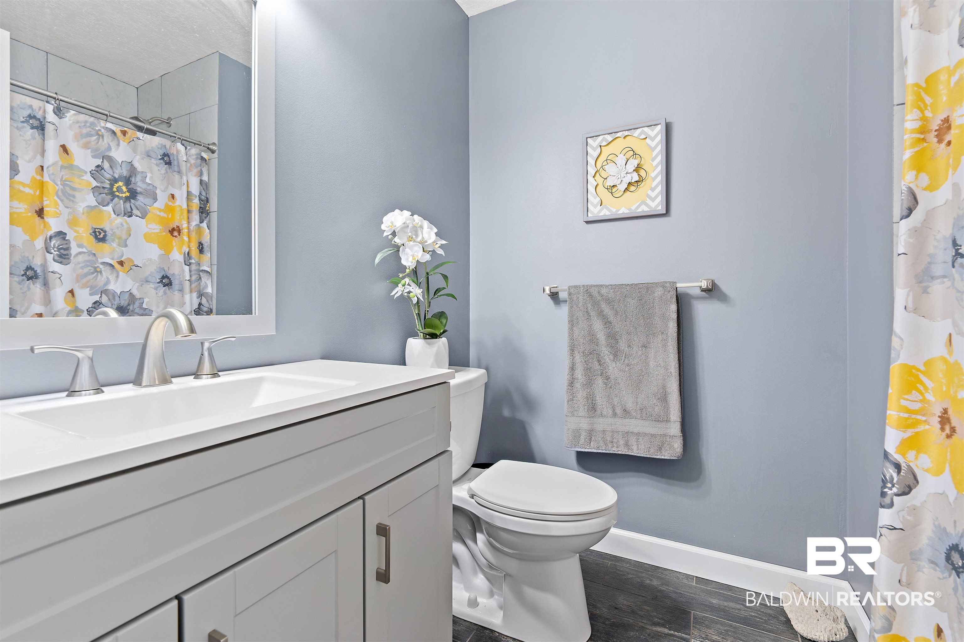 2000 Campfire Drive Semmes, AL 36575 - Photo 17 of 26 Bathroom with vanity, a textured ceiling, wood-type flooring, and toilet