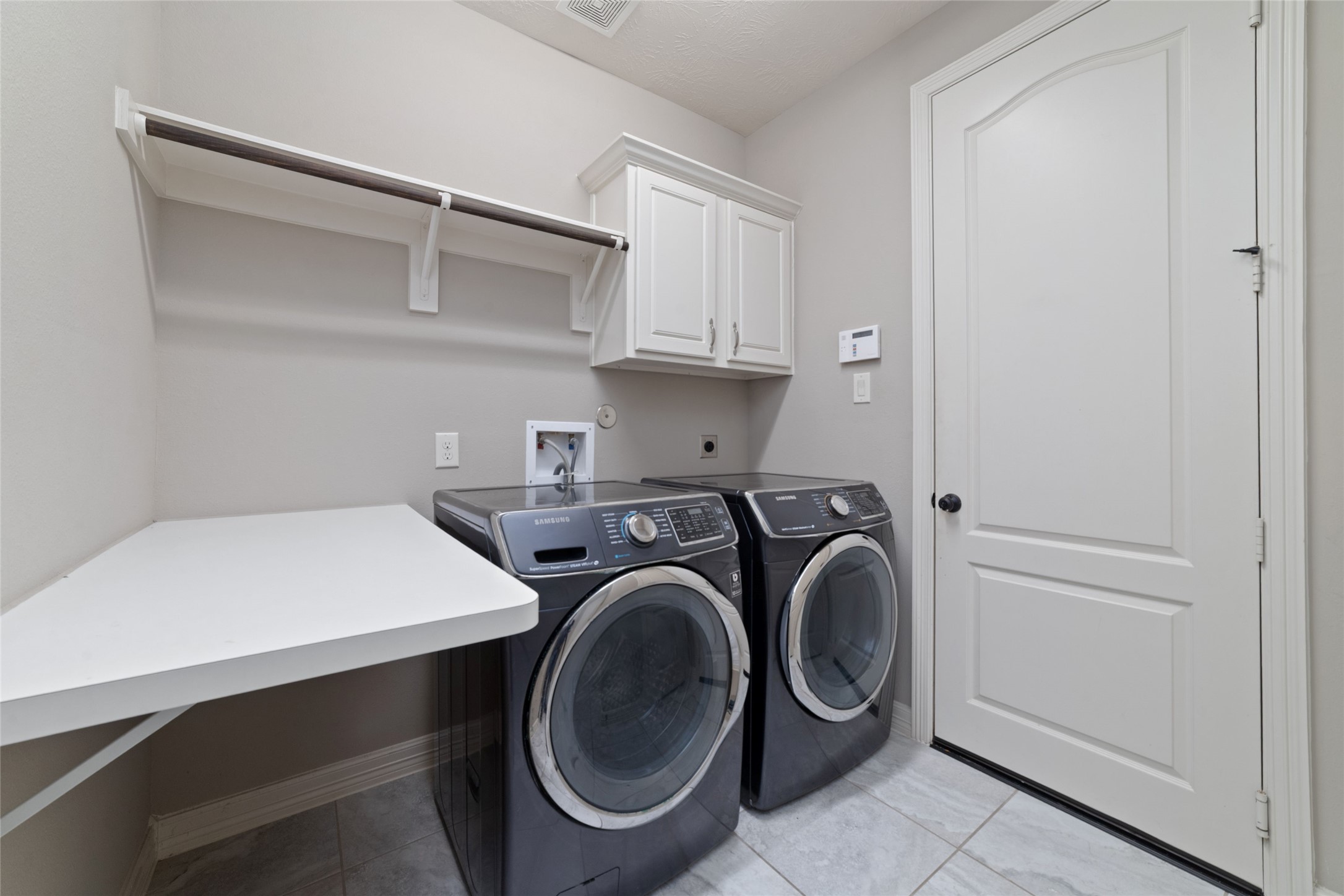 27506 Windcrest Key Lane Fulshear, TX 77441 - Photo 11 of 36 Laundry with washer/dryer included and laundry chute!