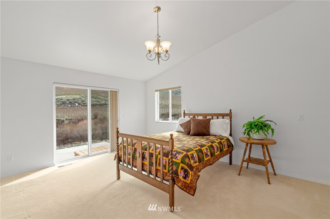 2711 Squilchuck Road Wenatchee, WA 98801 - Photo 13 of 32 a bedroom with a bed and a table