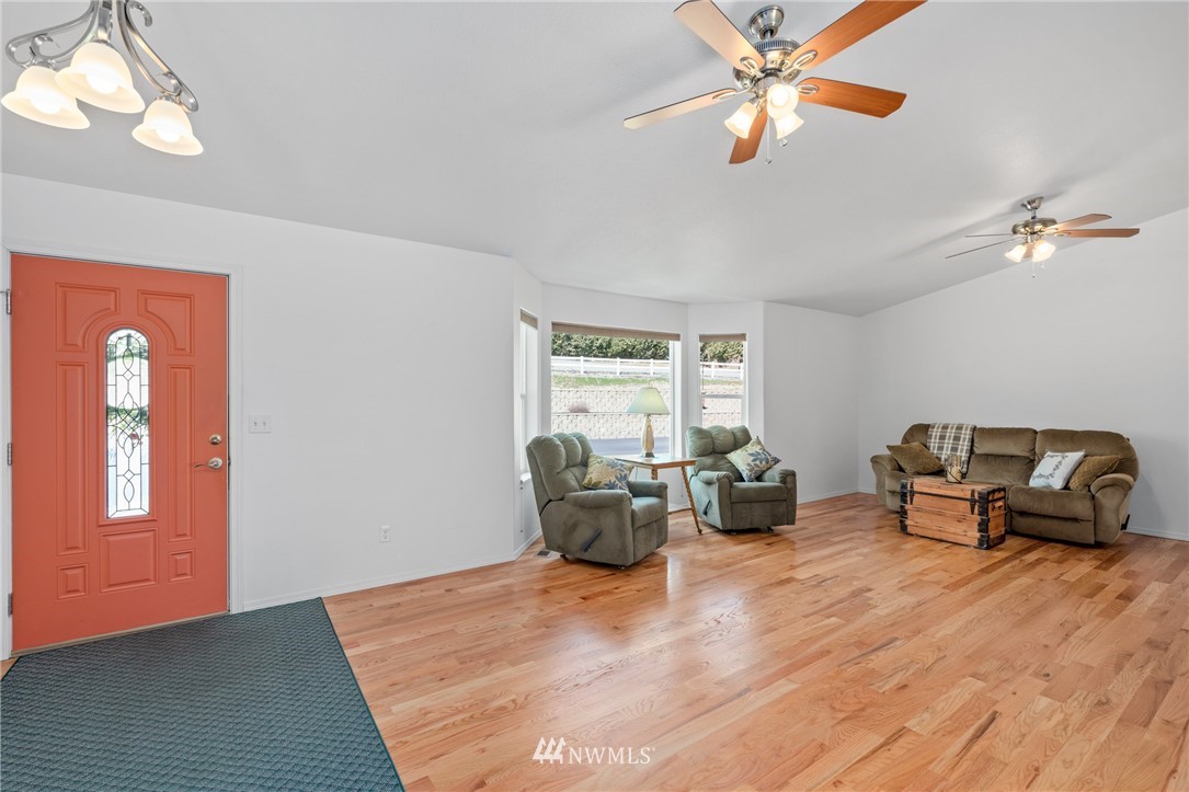 2711 Squilchuck Road Wenatchee, WA 98801 - Photo 4 of 32 a bedroom with furniture and wooden floor