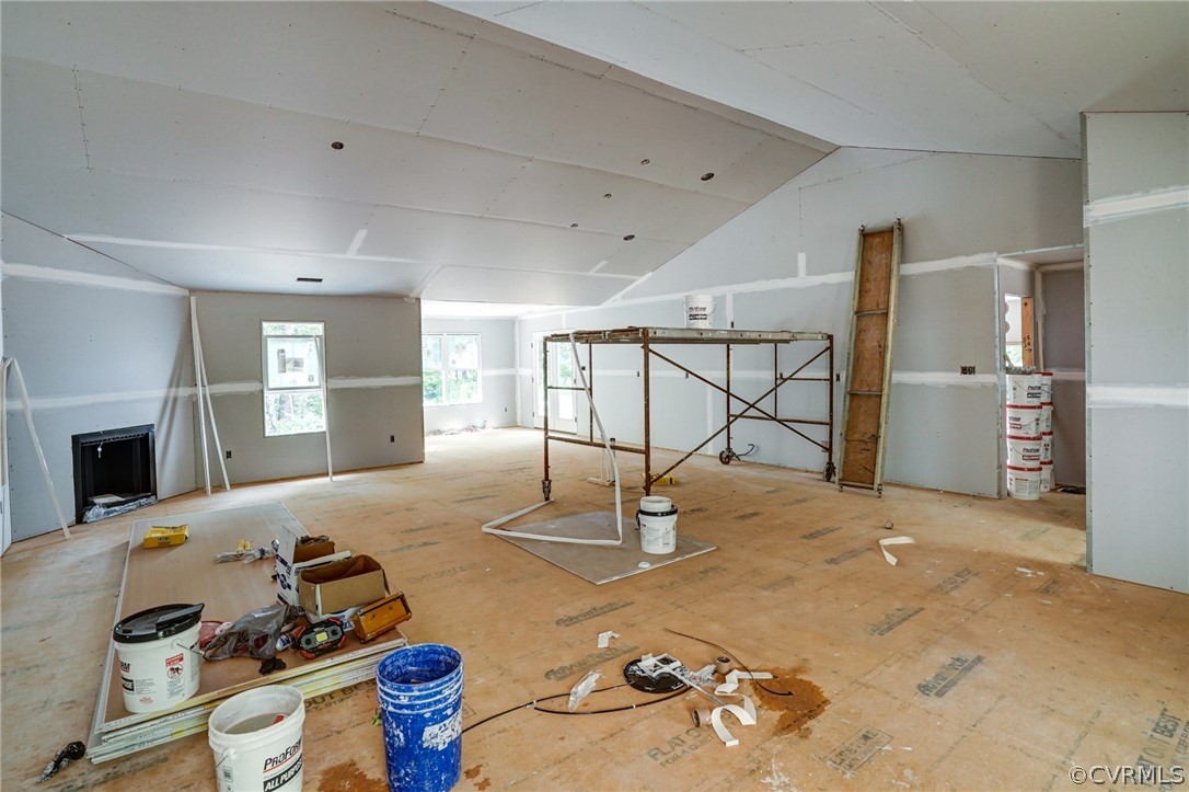 19173 Teman Road Beaverdam, VA 23015 - Photo 15 of 35 a room with gym equipment and a fireplace