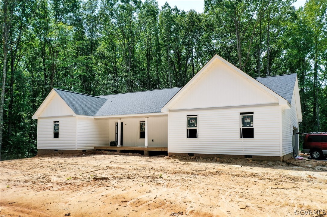19173 Teman Road Beaverdam, VA 23015 - Photo 5 of 35 a view of a white house with a yard